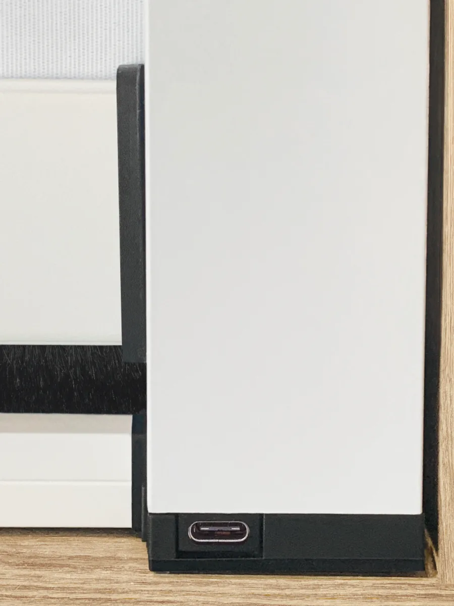 USB-C charging port detail on a motorised internal blackout blind