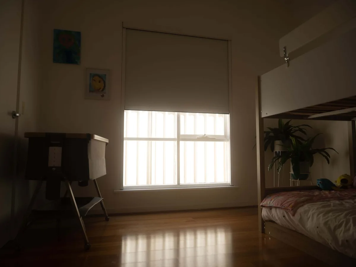 Close view of an internal blackout blind mounted inside the reveal
